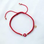 Pulsera Nico corona oro ojo rojo