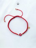 Pulsera Nico corona oro ojo rojo